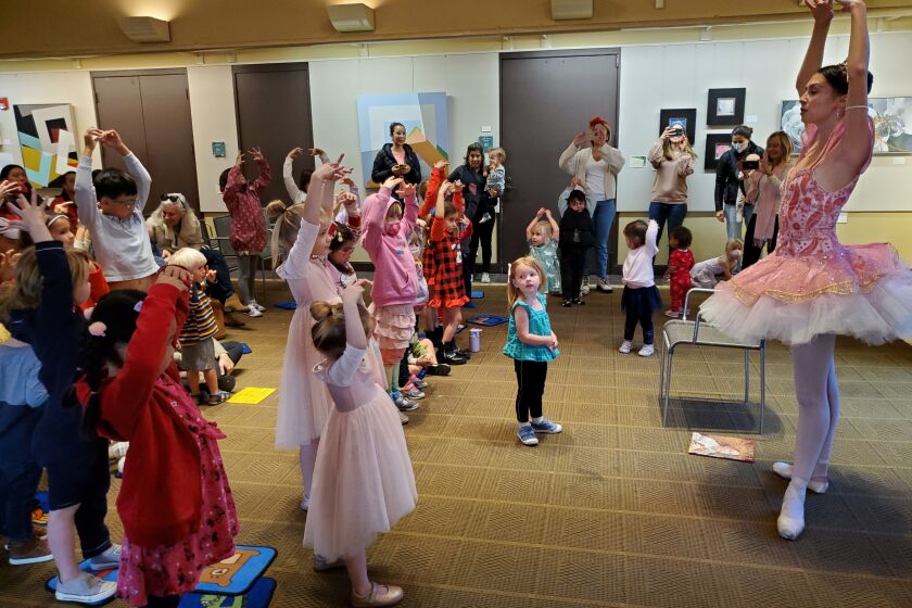 Ballerina Chiara Valle of City Ballet of San Diego leads La Jolla/Riford Library visitors in a ballet exercise Dec. 16.