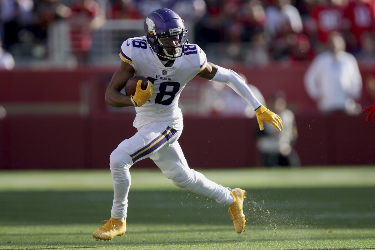 Minnesota Vikings wide receiver Justin Jefferson runs after a catch against the San Francisco 49ers.
