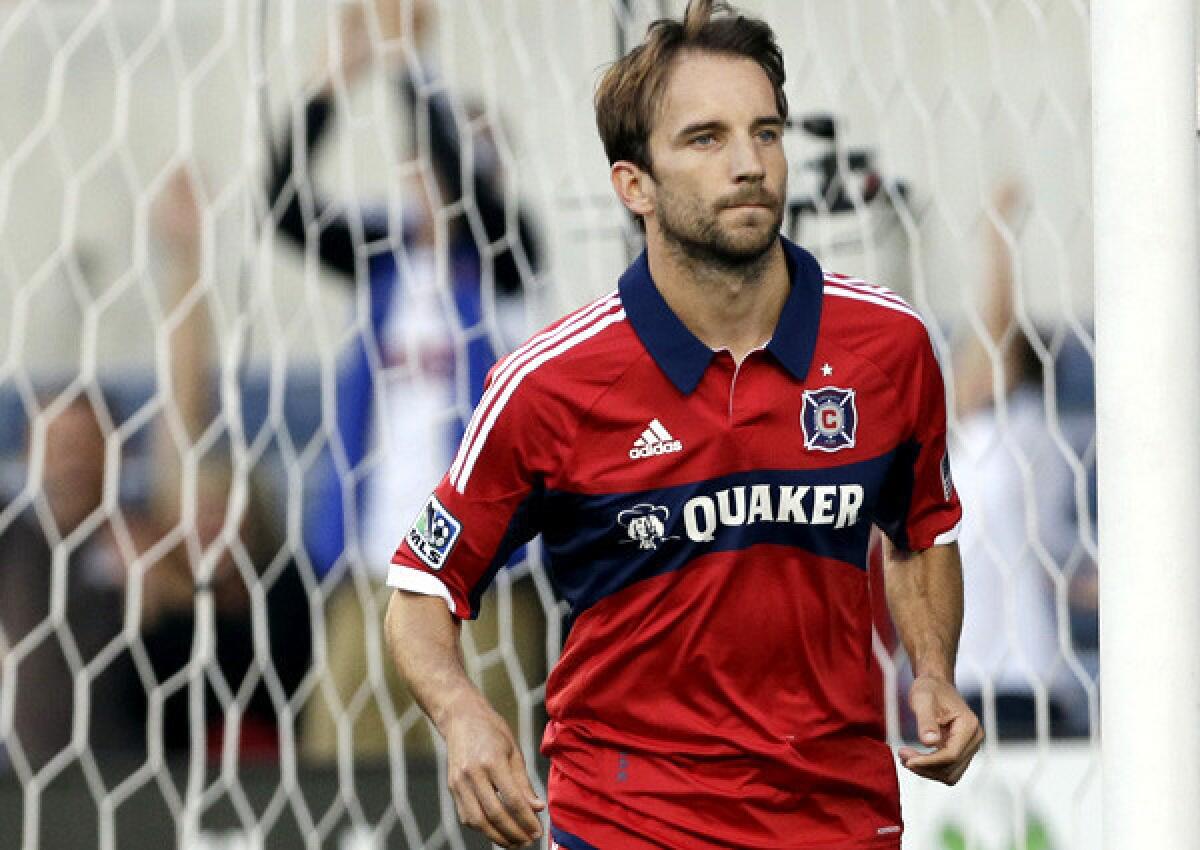 Chicago Fire midfielder Mike Magee heads away from the goal after scoring on a penalty kick in an MLS game against the Colorado Rapids last season.