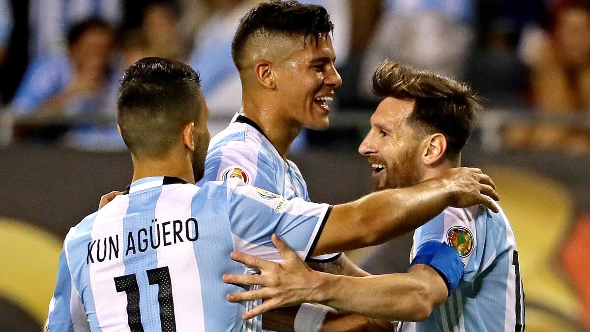Lionel Messi, right, celebrates his third goal against Panama with teammates Sergio Aguero (11) and Marcos Rojo on Friday night in Chicago.