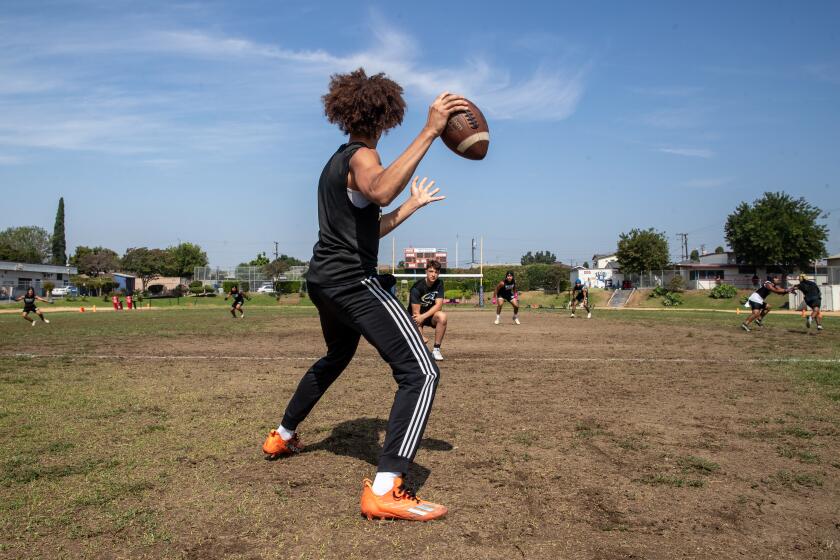 EAST LOS ANGELES, CA - JULY 22: Javen Hall,17, quarter back for Birmingham Community Charter School, during Summer passing competition with City Section teams held on Saturday, July 22, 2023 James A. Garfield High School in East Los Angeles, CA. (Irfan Khan / Los Angeles Times)