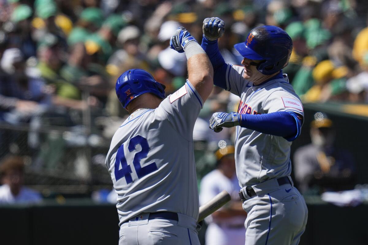 New York Mets' Daniel Vogelbach strike out swinging during the