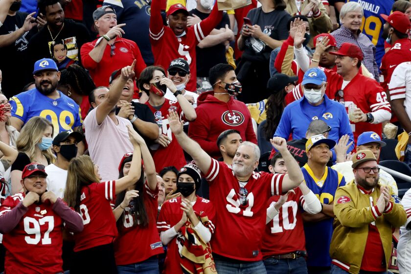 INGLEWOOD, CA - JANUARY 9, 2022: San Francisco 49ers fans cheer after the 49ers tied the game against the Rams in the second half on January 9, 2022 at SoFi Stadium in Inglewood, California.(Gina Ferazzi / Los Angeles Times)