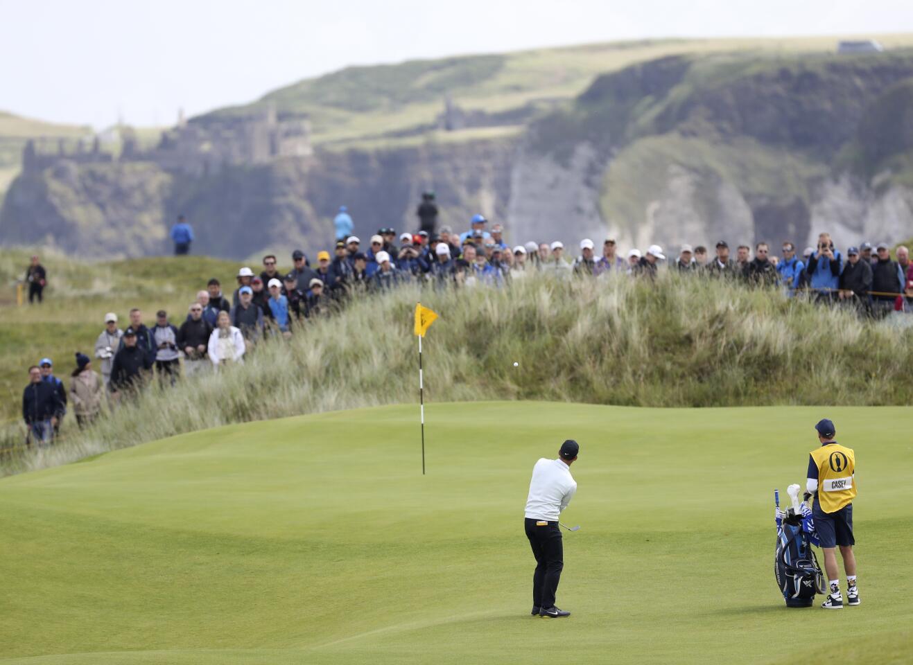 England's Paul Casey chips onto the eighth green during the first round of the 148th Open Championship at Royal Portrush Golf Club in Northern Ireland.