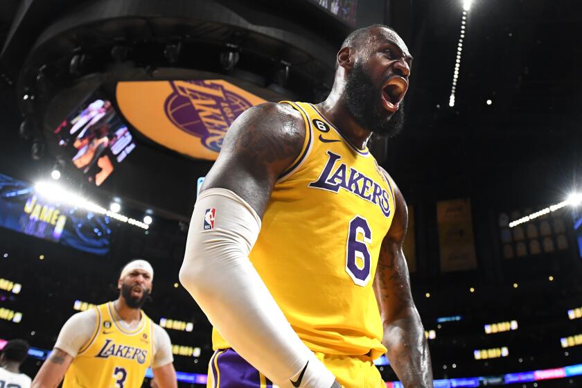 Los Angeles, California April 24, 2023-Lakers LeBron James celebrates his basket after being fouled by a Grizzlie player in overtime in Game 4 of the NBA playoffs at Crypto.com arena Monday. (Wally Skalij/Los Angeles Times)