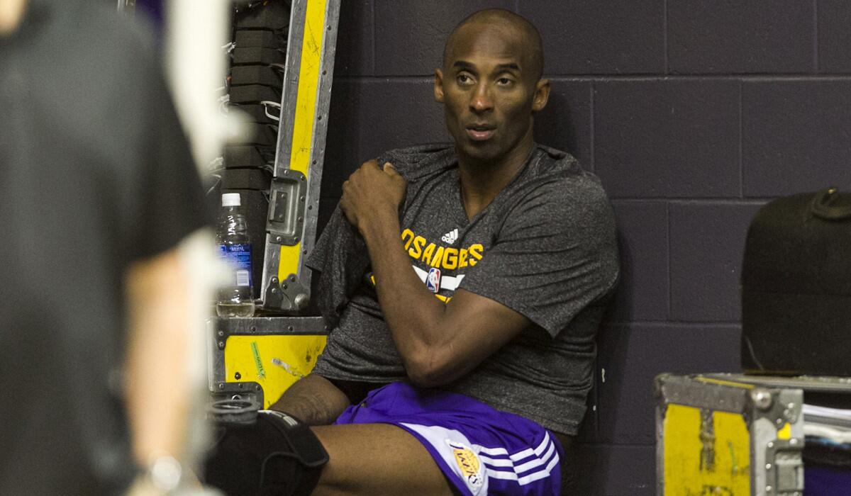 Los Angeles Lakers guard Kobe Bryant wears an ice pack on his shoulder during team practice on Tuesday.