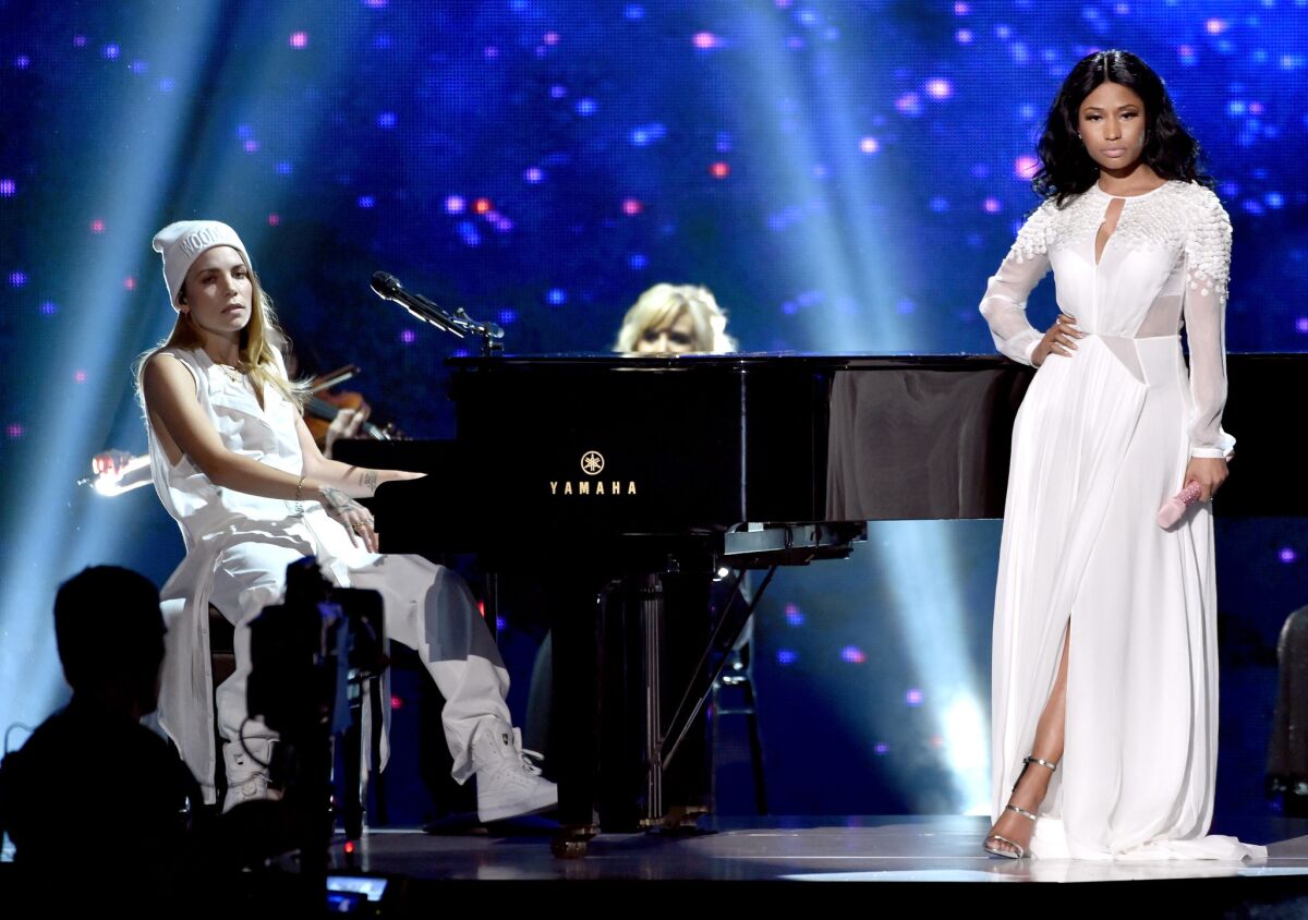 Skylar Grey, left, and Nicki Minaj perform at the 2014 American Music Awards.