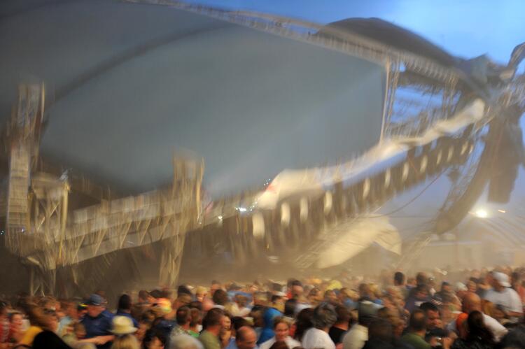 The overhead stage rigging collapses into the crowd in front of the stage at the Hoosier Lottery Grandstand at the Indiana State Fair. The collapse occurred before Sugarland took the stage.