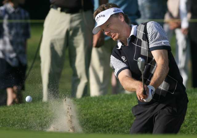 Bernhard Langer hits out of a bunker on the 15th hole during the second round of the Toshiba Classic golf tournament at Newport Beach Country Club on Saturday.