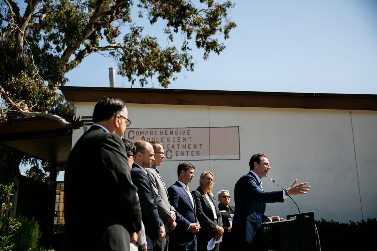 County Supervisor Nathan Fletcher speaks at a press conference alongside city councilmembers Chris Ward and Jennifer Campbell announcing a proposal to develop a "Regional Hub for Behavioral Health Continuum of Care" at a vacant Hillcrest property on Mar. 25, 2019.