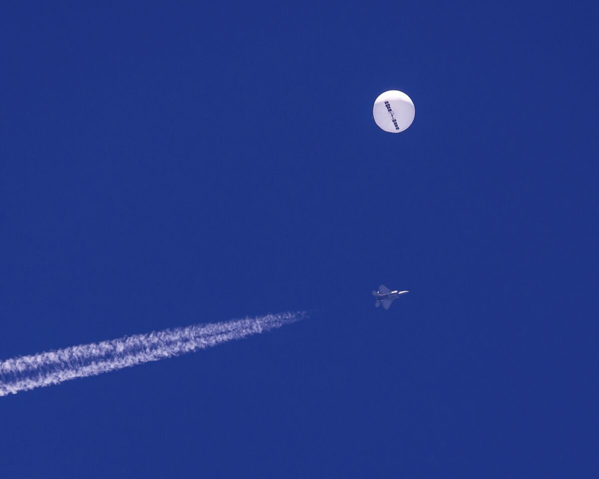 A suspected Chinese spy balloon drifts above the Atlantic Ocean before it was shot down by an F-22 fighter jet on Feb. 5.