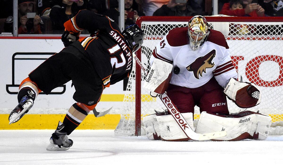 Coyotes goalie Mike Smith stops a shot by Ducks right wing Devante Smith-Pelly during the shootout Friday night in Anaheim.