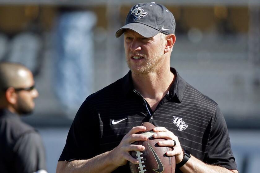 Central Florida head coach Scott Frost watches players warm up before the American Athletic Conference championship NCAA college football game, Saturday, Dec. 2, 2017, in Orlando, Fla. (AP Photo/John Raoux)
