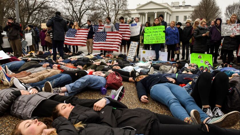 Students stage a "lie-in" Monday outside the White House in response to a school shooting Wednesday in Florida. The teens said they want stronger gun control and vowed to be heard on the issue.