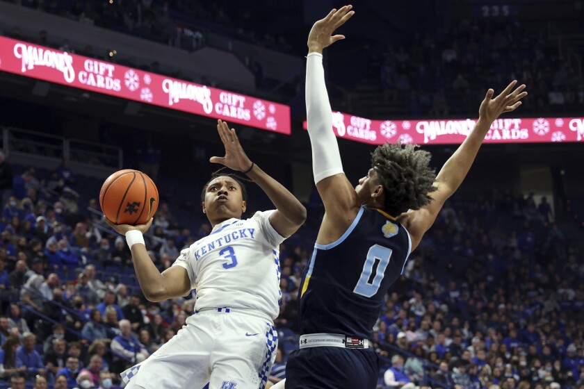 Kentucky's Tyty Washington Jr. (3) shoots while defended by Southern's Terrell Williams (0) during the first half of an NCAA college basketball game in Lexington, Ky., Tuesday, Dec. 7, 2021. (AP Photo/James Crisp)