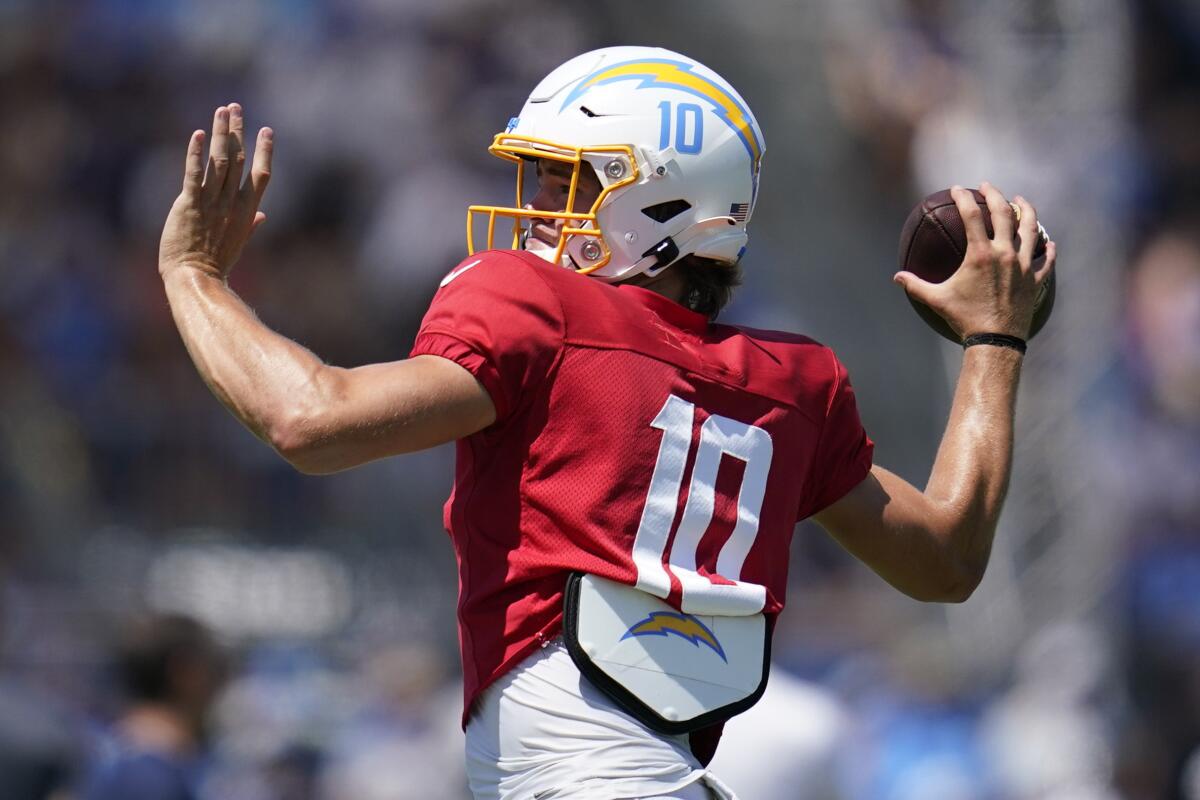  Chargers quarterback Justin Herbert (10) participates in drills during camp.