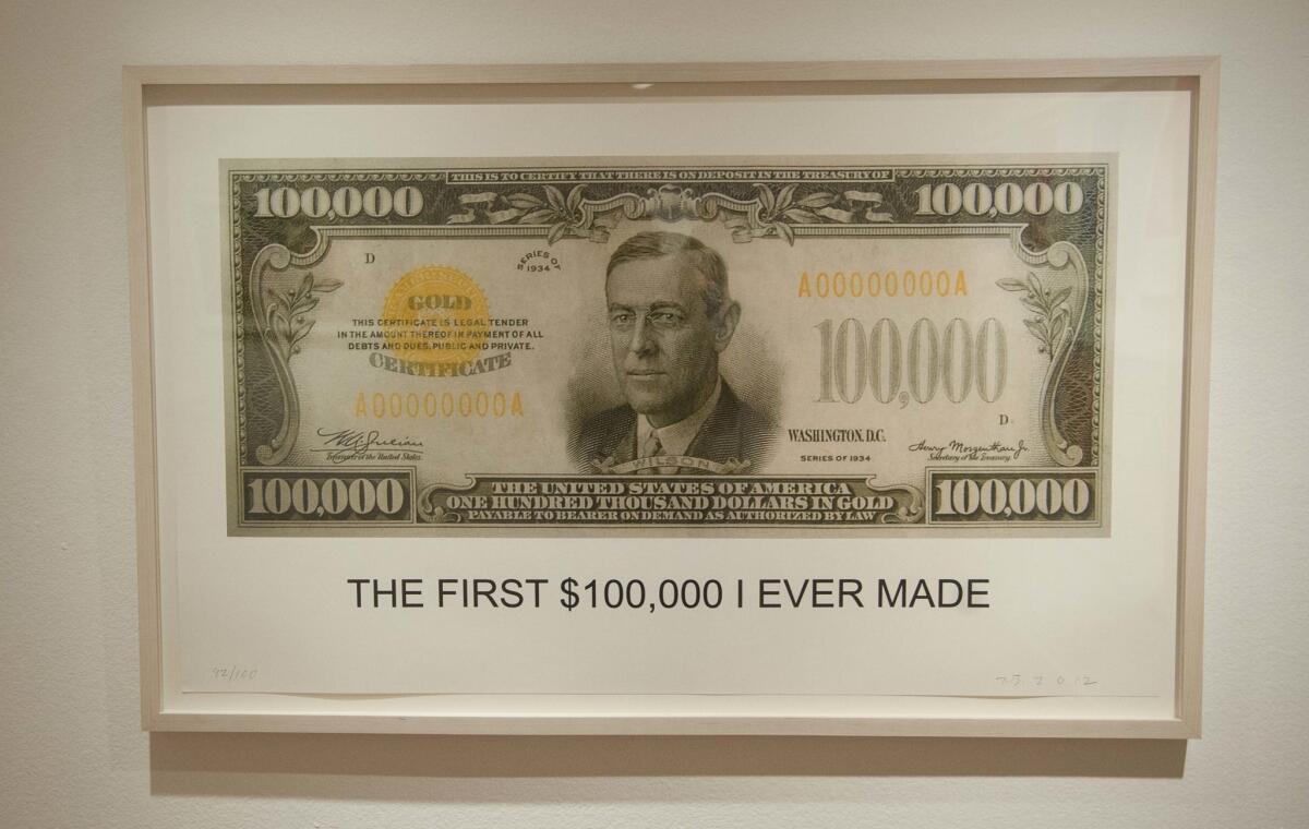 "The First $100,00 I Ever Made," a 2012 lithograph by John Baldessari on view at the Laguna Art Museum.