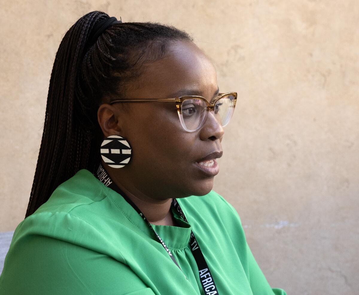 Kenyan filmmaker Becky Muikia is pictured wearing a green shirt. 