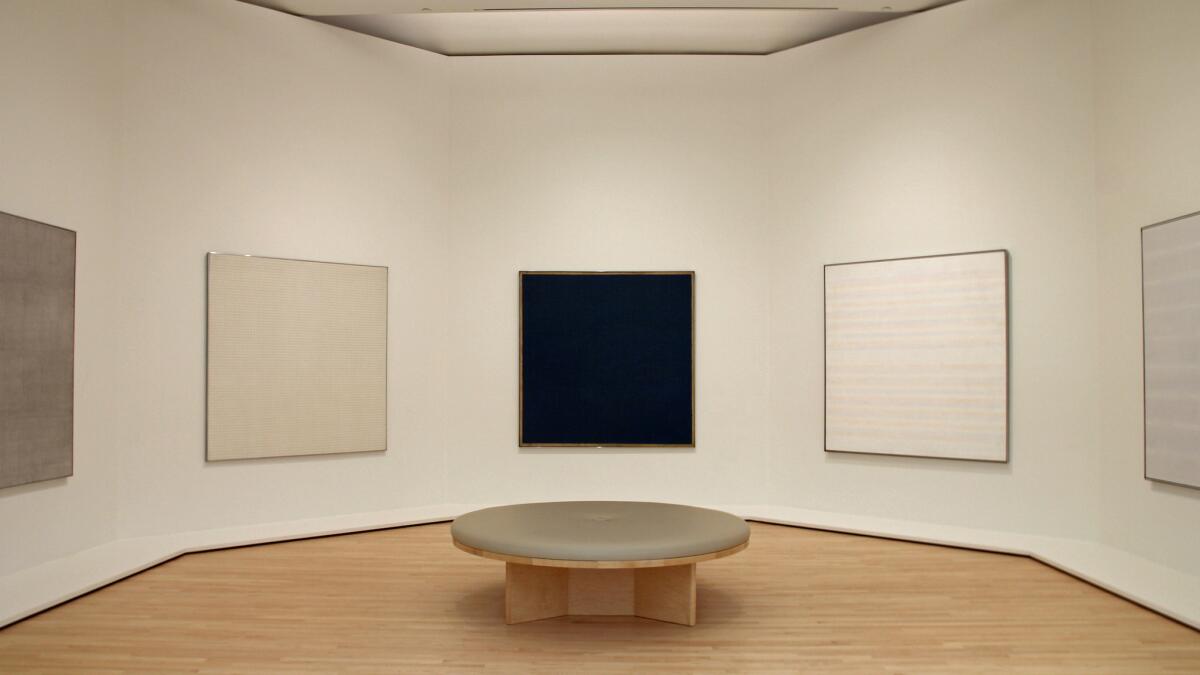 A hexagonal room of paintings by Agnes Martin on the fourth floor in the Fisher Collection galleries evokes the temple-like arrangement of the artist's paintings at the Harwood Museum of Art in Taos, N.M.