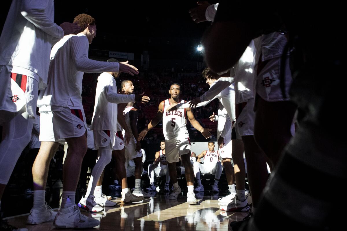 SDSU guard Lamont Butler (5) is announced with the starters before an exhibition game against San Diego Christian.