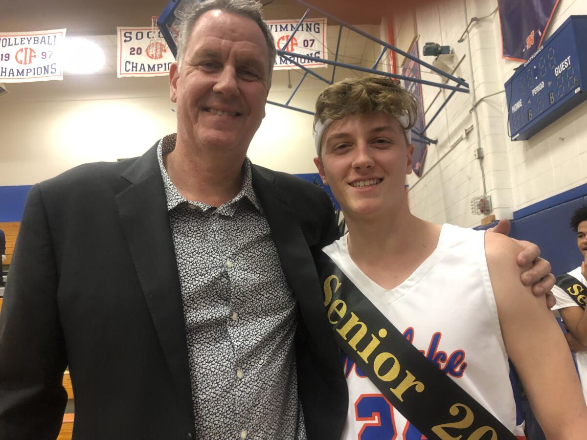 Former Simi Valley, UCLA and NBA standout Don MacLean with son, Kyle, a senior at Westlake, during senior night. 