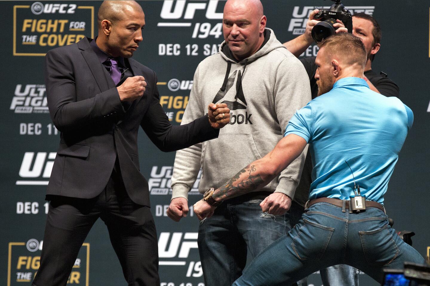 UFC featherweight champion Jose Aldo, left, poses for a photo with his opponent interim UFC featherweight champion Conor McGregor, right, during a UFC 194 news conference at the MGM Grand Garden Arena in Las Vegas, Wednesday, Dec. 9, 2015. (L.E. Baskow/Las Vegas Sun via AP) LAS VEGAS REVIEW-JOURNAL OUT; MANDATORY CREDIT