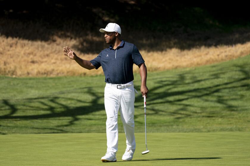PACIFIC PALISADES, CA - FEBRUARY 15, 2020: Harold Varner III acknowledges the crowd have sinking a birdie putt on the 4th hole during Round 3 of the Genesis Open at Riviera Country Club on February 15, 2020 in Pacific Palisades, California. He is tied for second place at 9 under par.