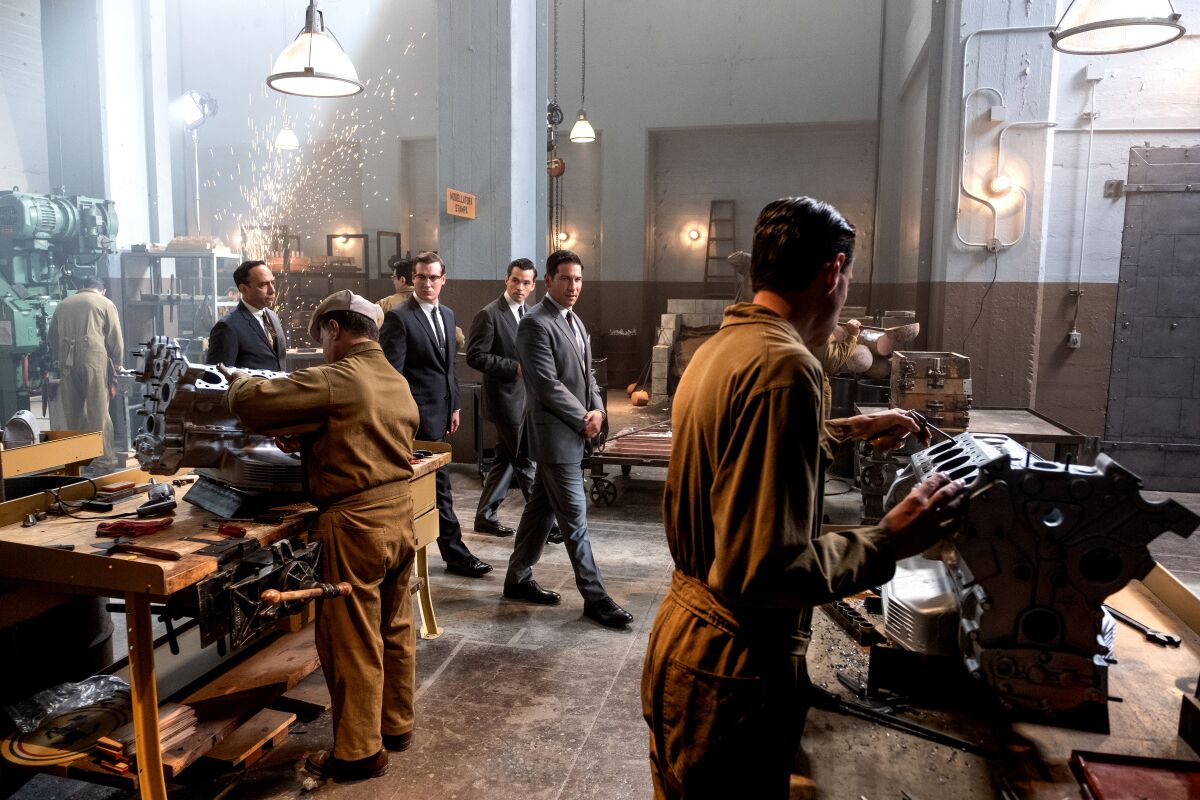 Scene from the 2019 movie "Ford v Ferrari." Lee Iacocca (Jon Bernthal) and his fellow Ford executives (Joe Williamson, Ian Harding) visit the Ferrari Factory. This scene depicting the Ferrari factory was shot at a Southern California Edison building in Eagle Rock.