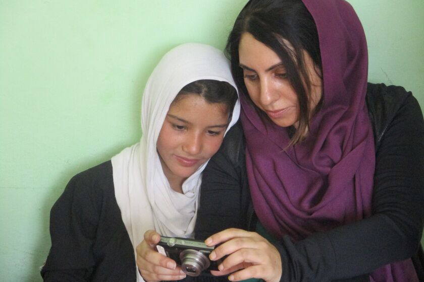Aria Raofi and her photography student before the bombing in Kabul, Afghanistan.