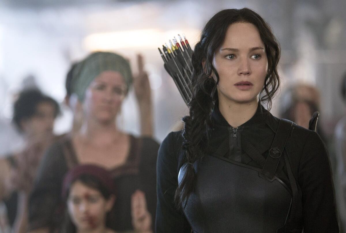 In this image released by Lionsgate, Jennifer Lawrence portrays Katniss Everdeen in a scene from "The Hunger Games: Mockingjay -- Part 1."