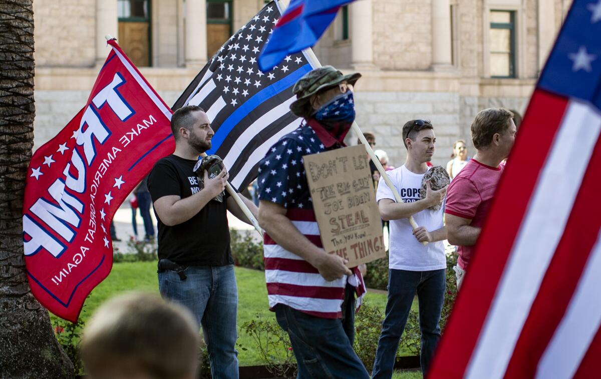 Donald Trump's supporters at a "Stop The Steal" rally in Phoenix hours after Joe Biden was named president-elect.
