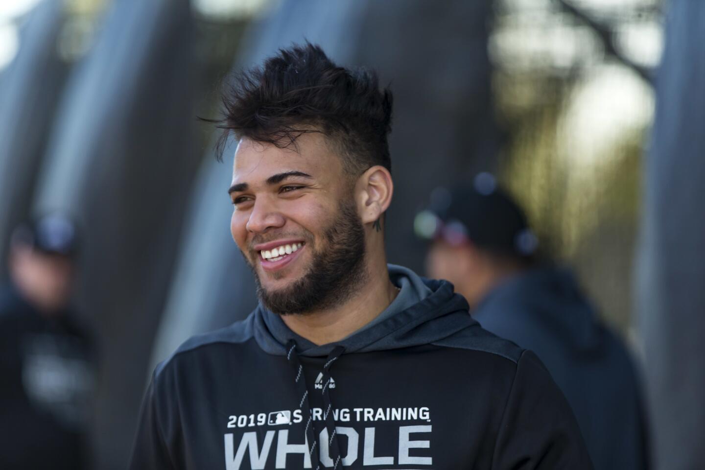 White Sox second baseman Yoan Moncada laughs at the batting cages at Camelback Ranch during spring training in Glendale, Ariz., on Saturday, Feb. 16, 2019.
