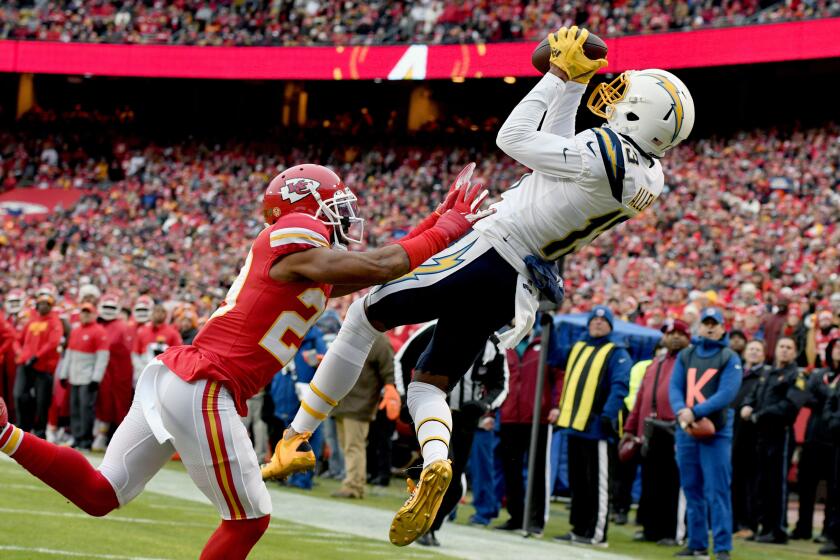 Los Angeles Chargers wide receiver Keenan Allen (13) makes a touchdown catch against Kansas City Chiefs cornerback Kendall Fuller (29) during the first half of an NFL football game in Kansas City, Mo., Sunday, Dec. 29, 2019. (AP Photo/Ed Zurga)