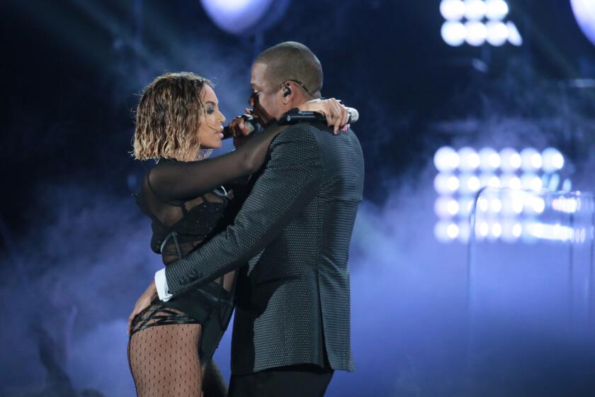 Hip-hop siren and entrepreneur Beyonce opens the Grammys with husband and hip-hop mogul Jay Z, singing the track "Drunk in Love." The pair amass massive cheers from the audience.