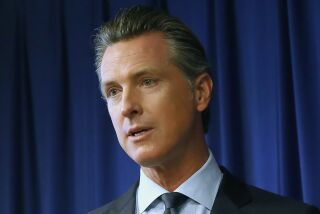 Gov. Gavin Newsom speaks at a news conference Wednesday, Sept. 18, 2019, in Sacramento, Calif. Newsom signed sweeping labor legislation that aims to give wage and benefit protections to rideshare drivers at companies like Uber and Lyft and to workers across other industries. (AP Photo/Rich Pedroncelli)