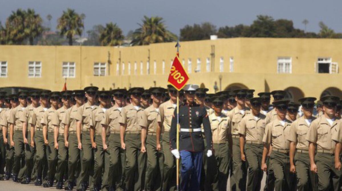Marine recruits from Platoon 2103 march in a ceremony during which they are each awarded the eagle, globe and anchor - the official emblem of the United States Marine Corps.
