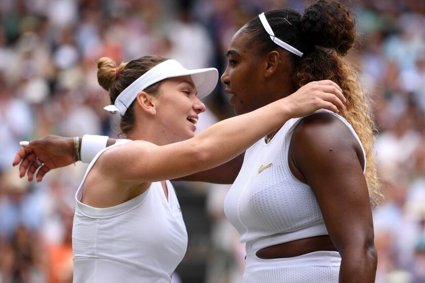 LONDON, ENGLAND - JULY 13: Serena Williams of The United States and Simona Halep of Romania embrace after their Ladies' Singles final during Day twelve of The Championships - Wimbledon 2019 at All England Lawn Tennis and Croquet Club on July 13, 2019 in London, England. (Photo by Laurence Griffiths/Getty Images) ** OUTS - ELSENT, FPG, CM - OUTS * NM, PH, VA if sourced by CT, LA or MoD **