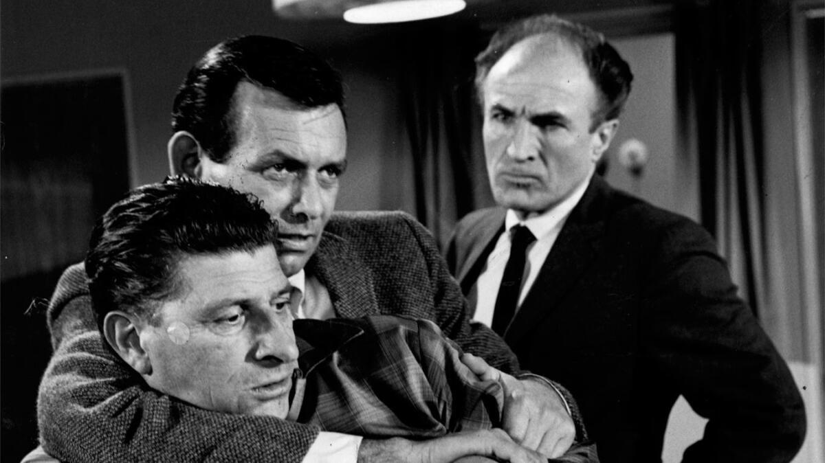 William Raisch, the one-armed man; David Janssen as Richard Kimble and Barry Morse as Lt. Gerard in a 1967 episode of "The Fugitive."