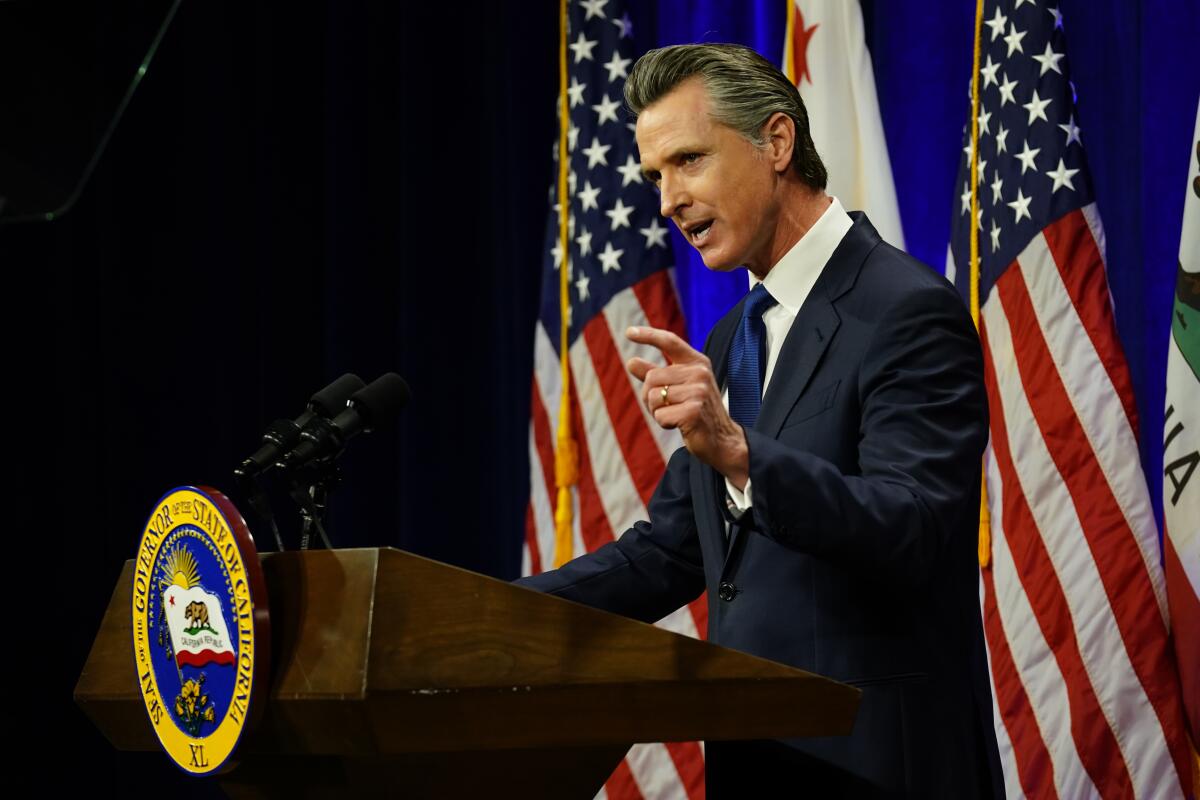 Gov. Gavin Newsom speaks at a lectern