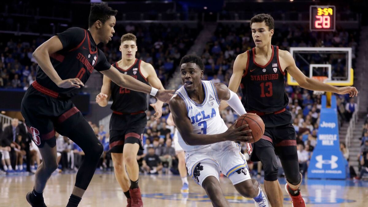 UCLA guard Aaron Holiday (3) drives to the basket against Stanford during the first half.