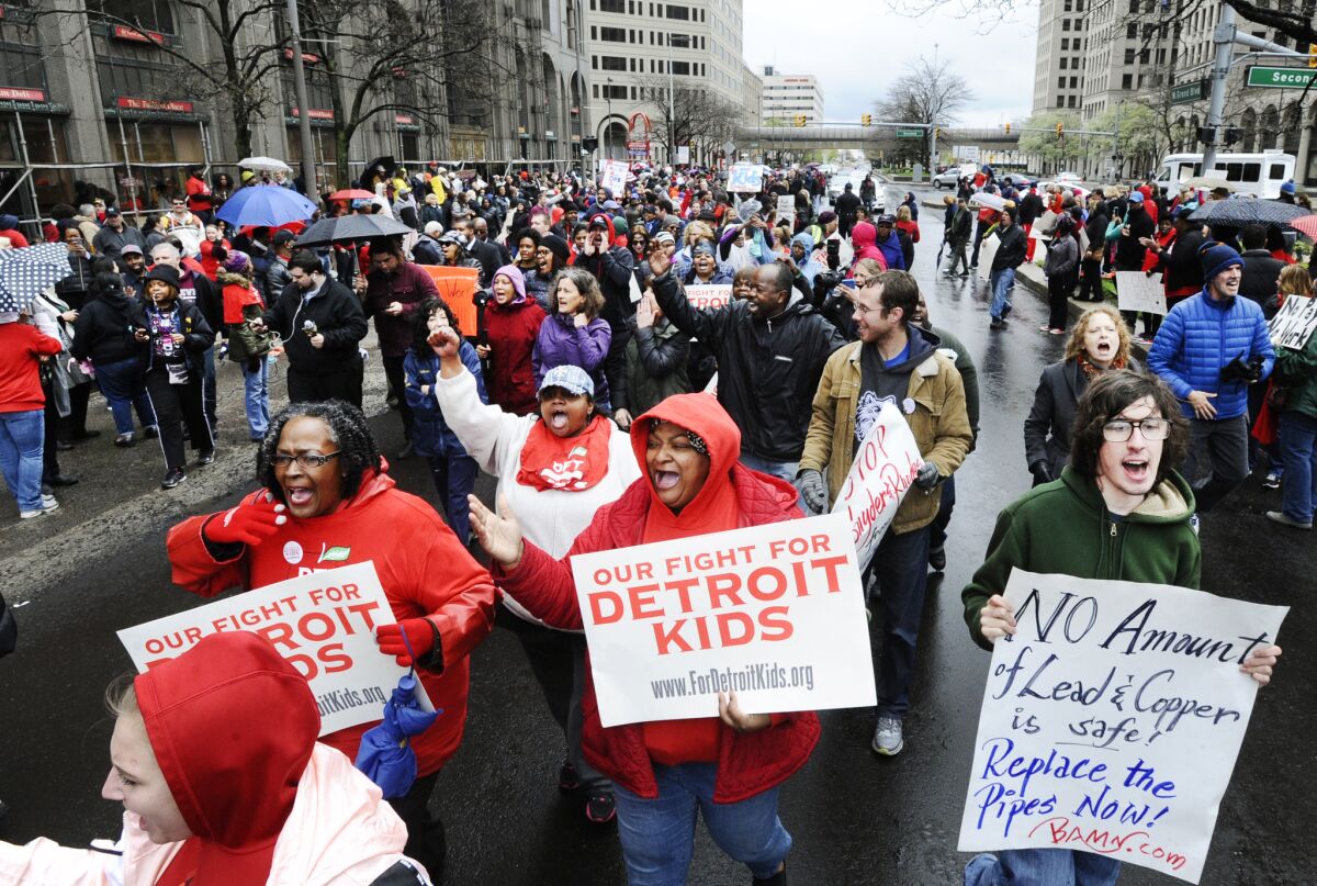 Members of the Detroit Federation of Teachers rally in front of the Detroit Public Schools offices on May 2, 2016.