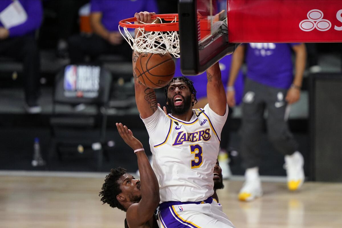 Lakers forward Anthony Davis gets inside for a dunk during Game 6.