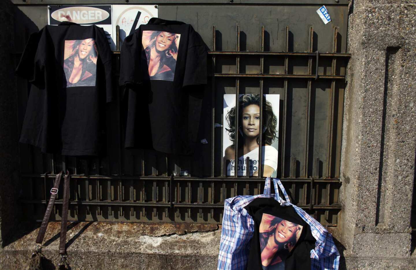 Whitney Houston merchandise is displayed for sale near the site of her funeral in Newark, N.J.