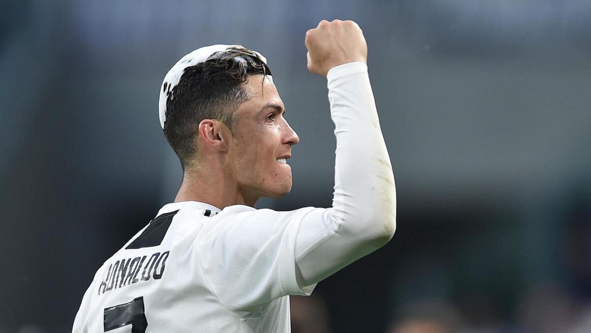 Juventus forward Cristiano Ronaldo celebrates after winning the Italian Serie A championship on Saturday.
