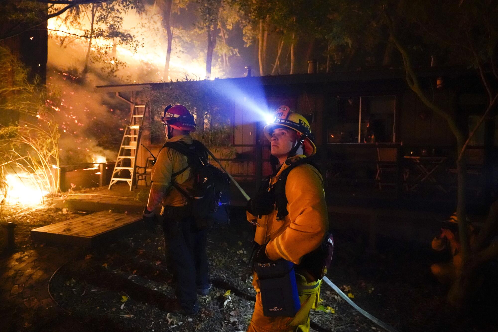 Firefighters work in the Santa Cruz Mountains near Boulder Creek.