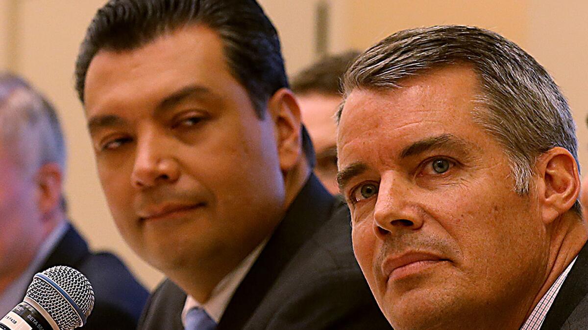 Alex Padilla, left, and Pete Peterson are shown in downtown Los Angeles in March. Both are running for the position of California secretary of state.