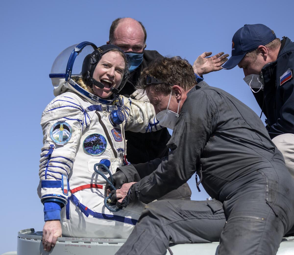 Expedition 64 NASA astronaut Kate Rubins is helped out of the Soyuz MS-17 spacecraft just minutes after she, and Roscosmos cosmonauts Sergey Kud-Sverchkov and Sergey Ryzhikov landed in a remote area near the town of Zhezkazgan, Kazakhstan on Saturday, April 17, 2021. Rubins, Ryzhikov and Kud-Sverchkov returned after 185 days in space having served as Expedition 63-64 crew members onboard the International Space Station. (Bill Ingalls/NASA via AP)