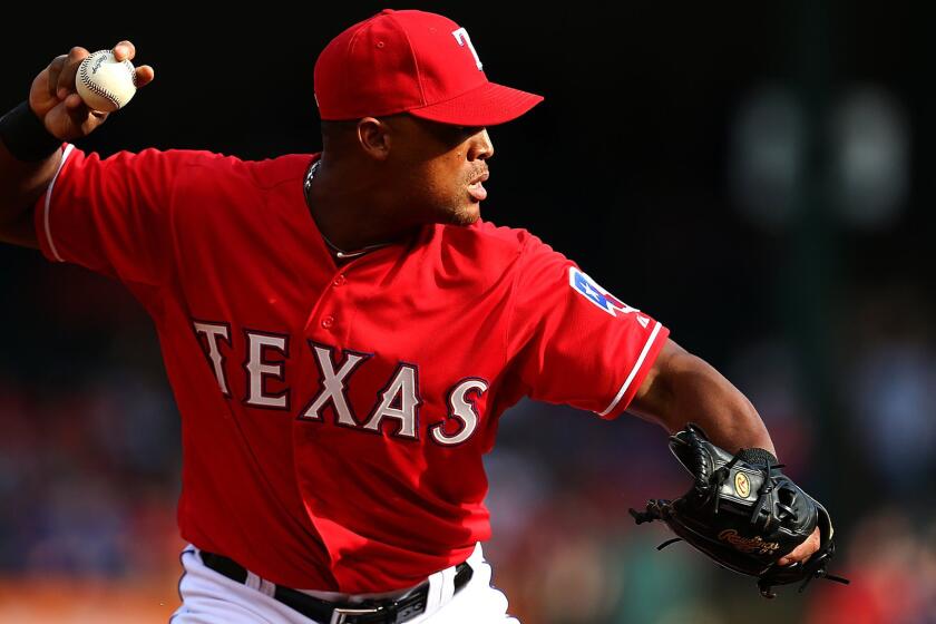 Rangers third baseman Adrian Beltre makes a throw to first base to an out during the first inning of a game against Red Sox on Saturday. The Rangers have put Beltre on the 15-day disabled list on Monday.