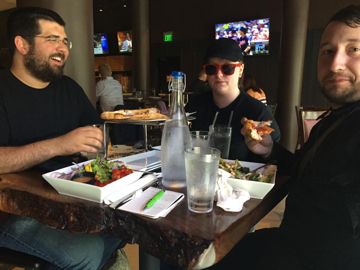 Matthew Heimbach, left, Katherine Amsel and Scott Hess, all members of the white nationalist Traditionalist Worker Party, eat lunch in Cleveland.