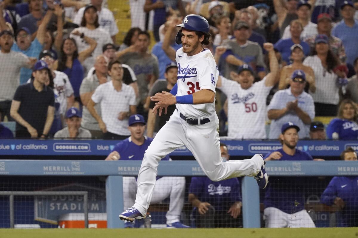 Cody Bellinger scores a run against the San Francisco Giants in July.
